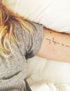 Un tatouage à l'intérieur du bras : une citation