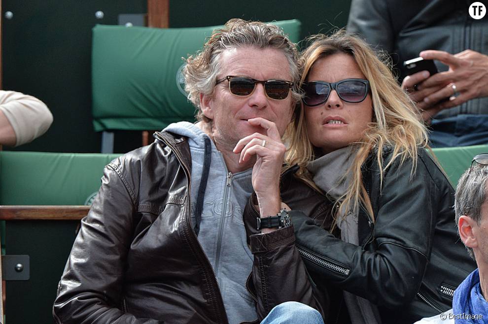   Denis Brogniart et sa femme Hortense assistent au match de Gael Monfils au 2eme Tour des Internationaux de France de tennis de Roland Garros le 29 mai 2013.  