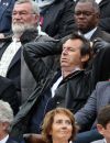   Jean-Luc Reichmann, sa femme Nathalie et Philippe Bas - People dans les tribunes des Internationaux de France de tennis de Roland Garros à Paris. Le 31 mai 2015.  