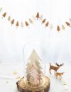 Un socle de pin et de petits sapins en carton pour un Noël créatif