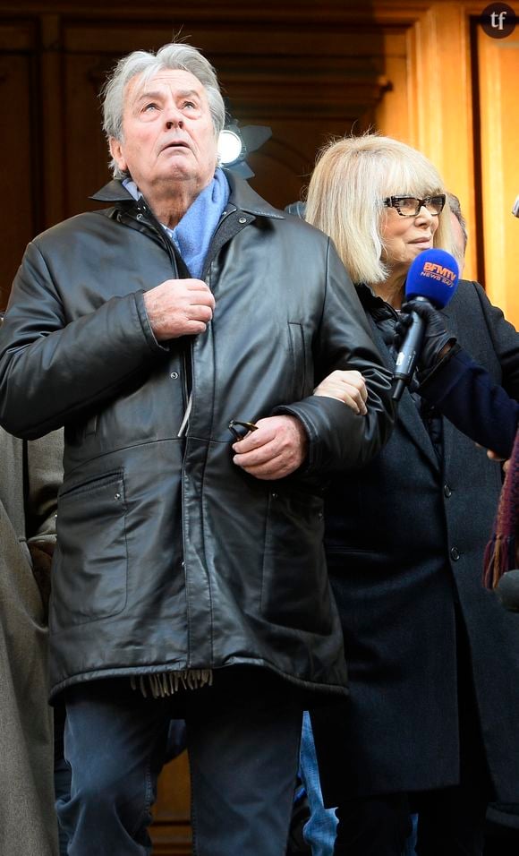 Alain Delon et Mireille Darc - Hommage a Georges Lautner en l'eglise Saint-Roch a Paris. Le 5 decembre 2013 