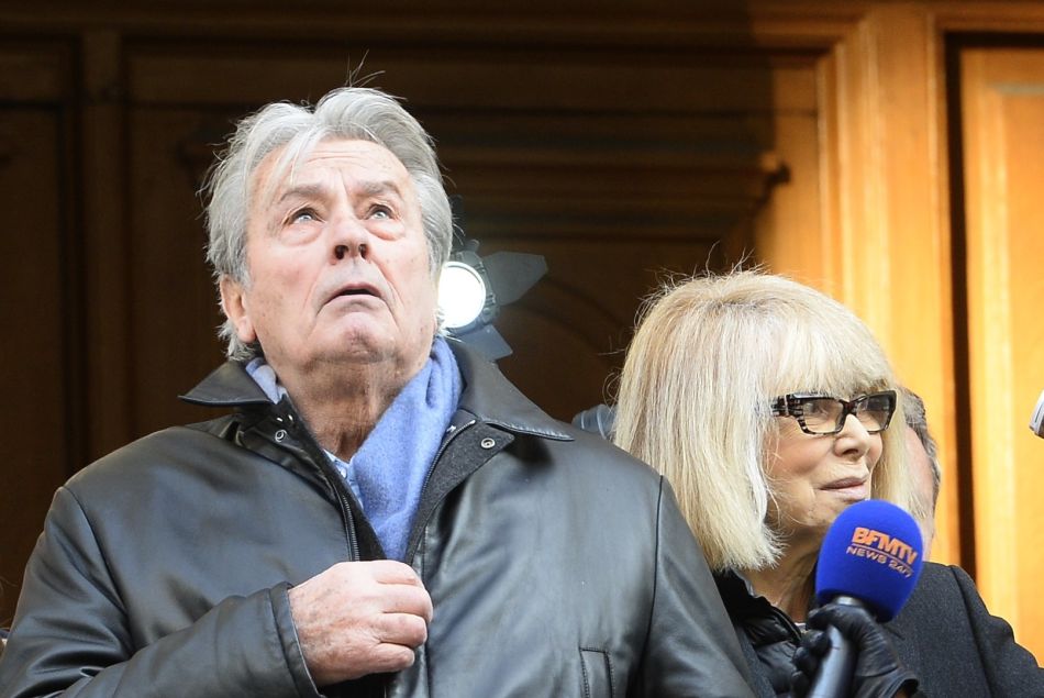 Alain Delon et Mireille Darc - Hommage a Georges Lautner en l'eglise Saint-Roch a Paris. Le 5 decembre 2013 
