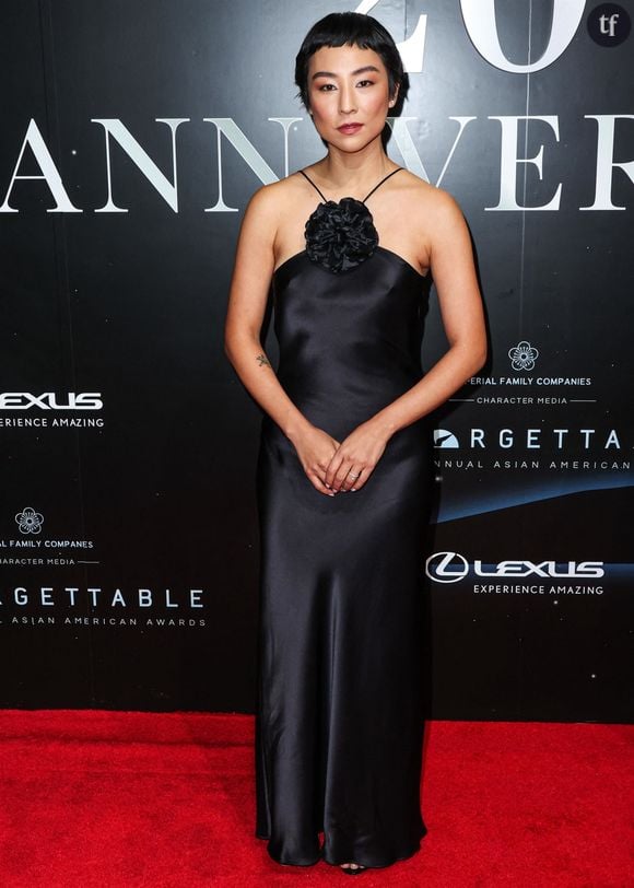 C'est délicat comme de la dentelle, sans être jamais gnan gnan ou trop fleur bleue. Simplement authentique et juste.
Greta Lee au photocall de la soirée de gala des "20th Annual Asian American Awards" au Beverly Hilton Hotel à Los Angeles, le 17 décembre 2022. 