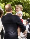   Le prince William et le prince George de Cambridge - Sorties après le baptême de la princesse Charlotte de Cambridge à l'église St. Mary Magdalene à Sandringham, le 5 juillet 2015.  