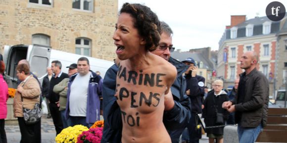 Marine Le Pen bousculée par deux Femen - vidéo