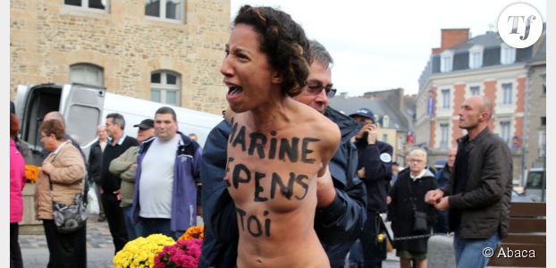 Marine Le Pen bousculée par deux Femen - vidéo