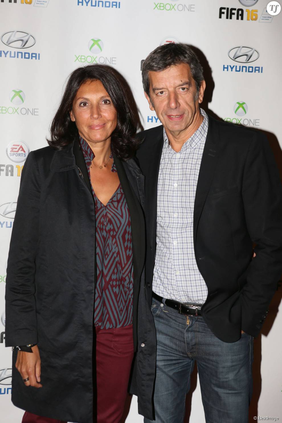  Michel Cymes et sa femme Nathalie - Soirée de lancement du jeu vidéo &quot;FIFA 2016&quot; au Faust à Paris, le 21 septembre 2015.  