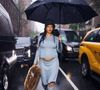 New York, NY  - Rihanna steps out in the rain, proudly debuting her baby bump ahead of the Met Gala.



Pictured: Rihanna
